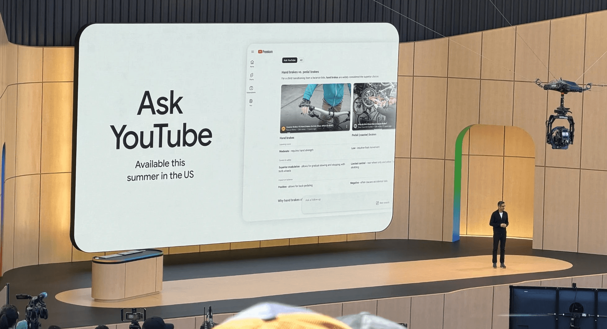 Google I/O 2026 keynote slide announcing Ask YouTube, a conversational YouTube search launching this summer in the US